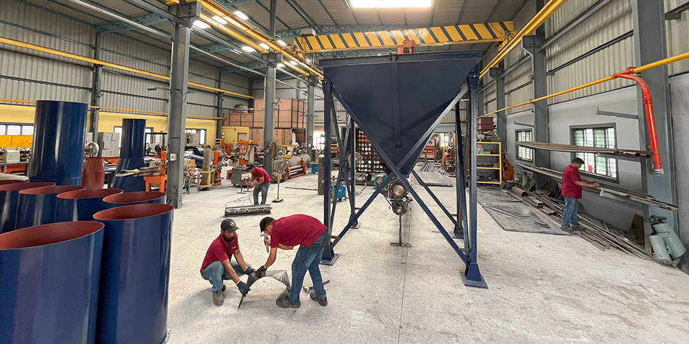 The Techedge manufacturing facility in Bengaluru, showing workers assembling industrial equipment.